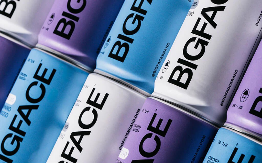 BIGFACE Coffee’s ready-to-drink products feature several colorful cans with bold, eye-catching designs that reflect the brand’s dynamic and modern identity.