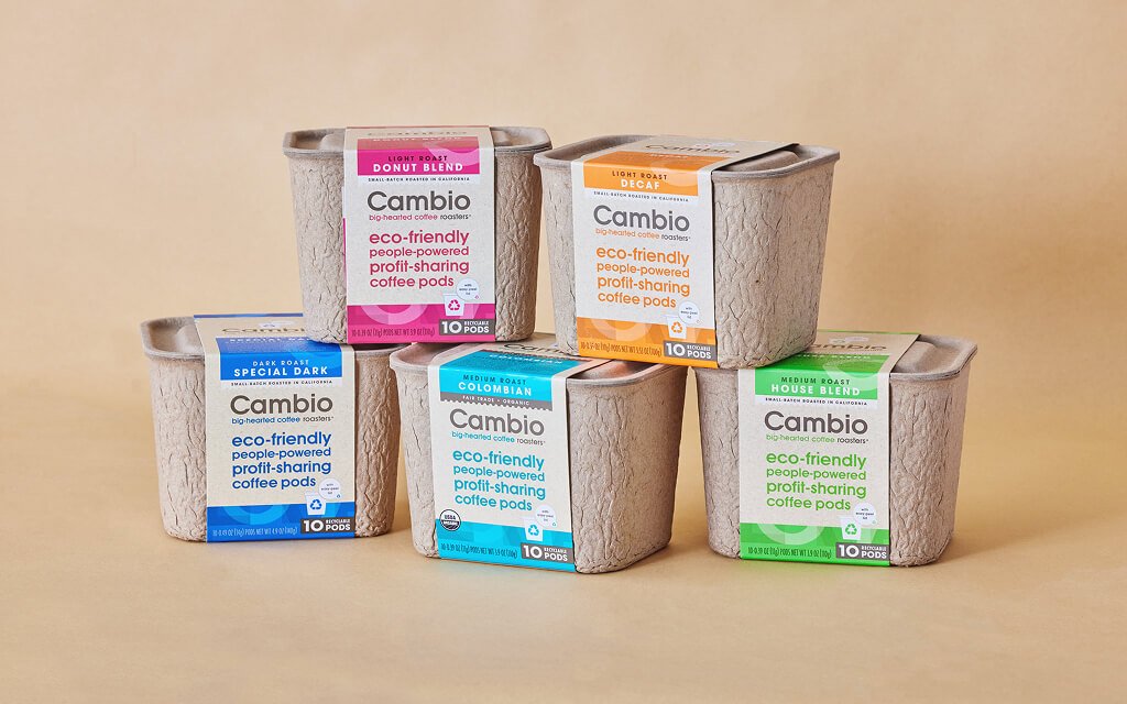 Cambio eco-friendly coffee pods in recyclable fiber-based packaging, promoting sustainability and carbon footprint reduction.
