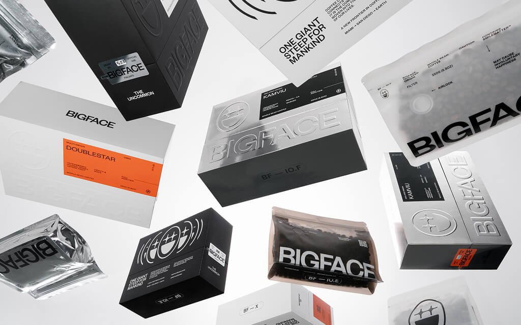 BIGFACE Coffee packaging by Zenpack with striking geometric patterns, metallic details, and innovative box design.