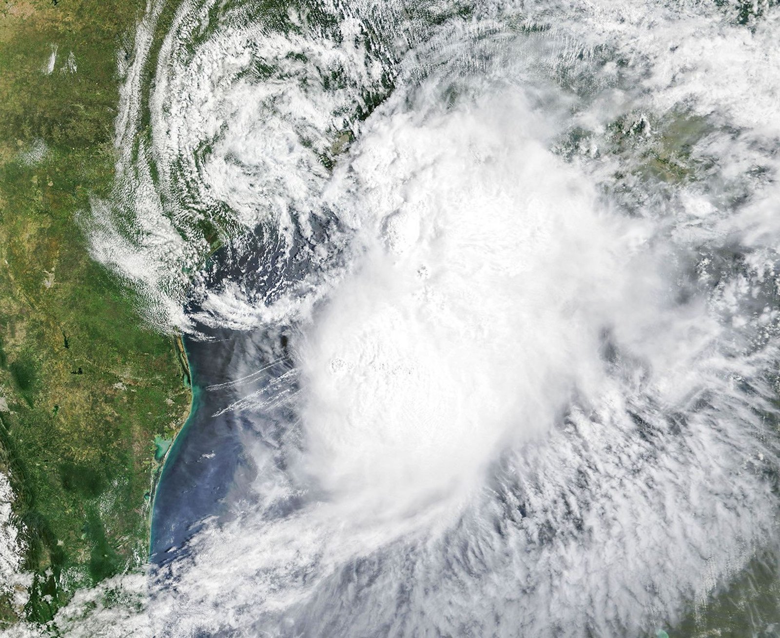 Tropical Storm Arthur’s white storm clouds cover the waters off the U.S. Gulf Coast. Some clouds extend inland over parts of Texas and Louisiana.