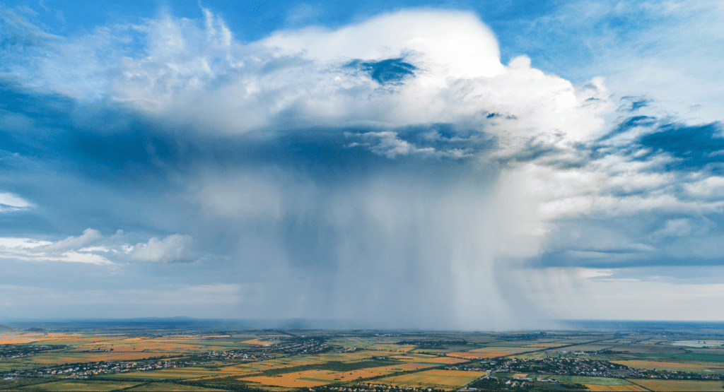 rain cloud over rural farm ground