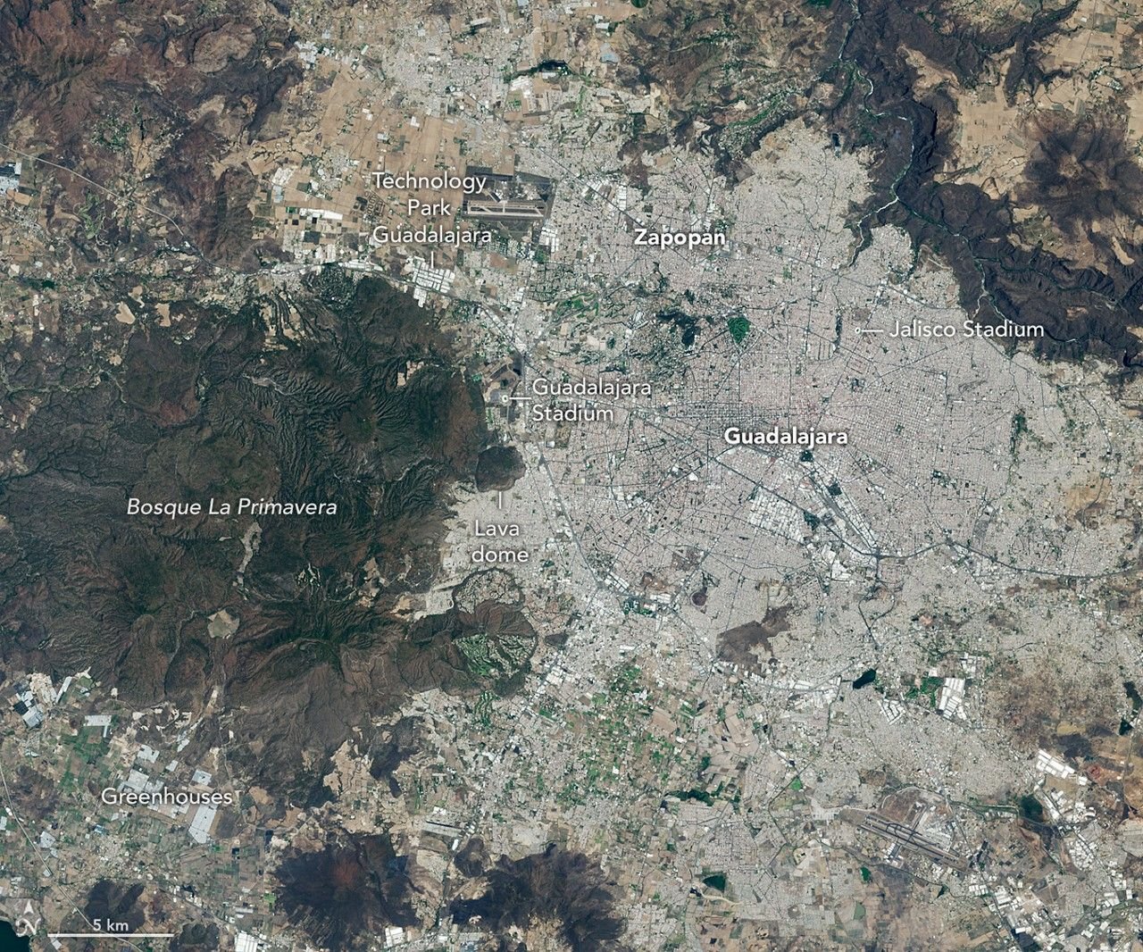 Images of Guadalajara in 1986 (left) and 2026 (right) shows the city expanding westward into an area that had been mostly farmland. Guadalajara Stadium appears as a small circular feature on the left side of the 2026 image.