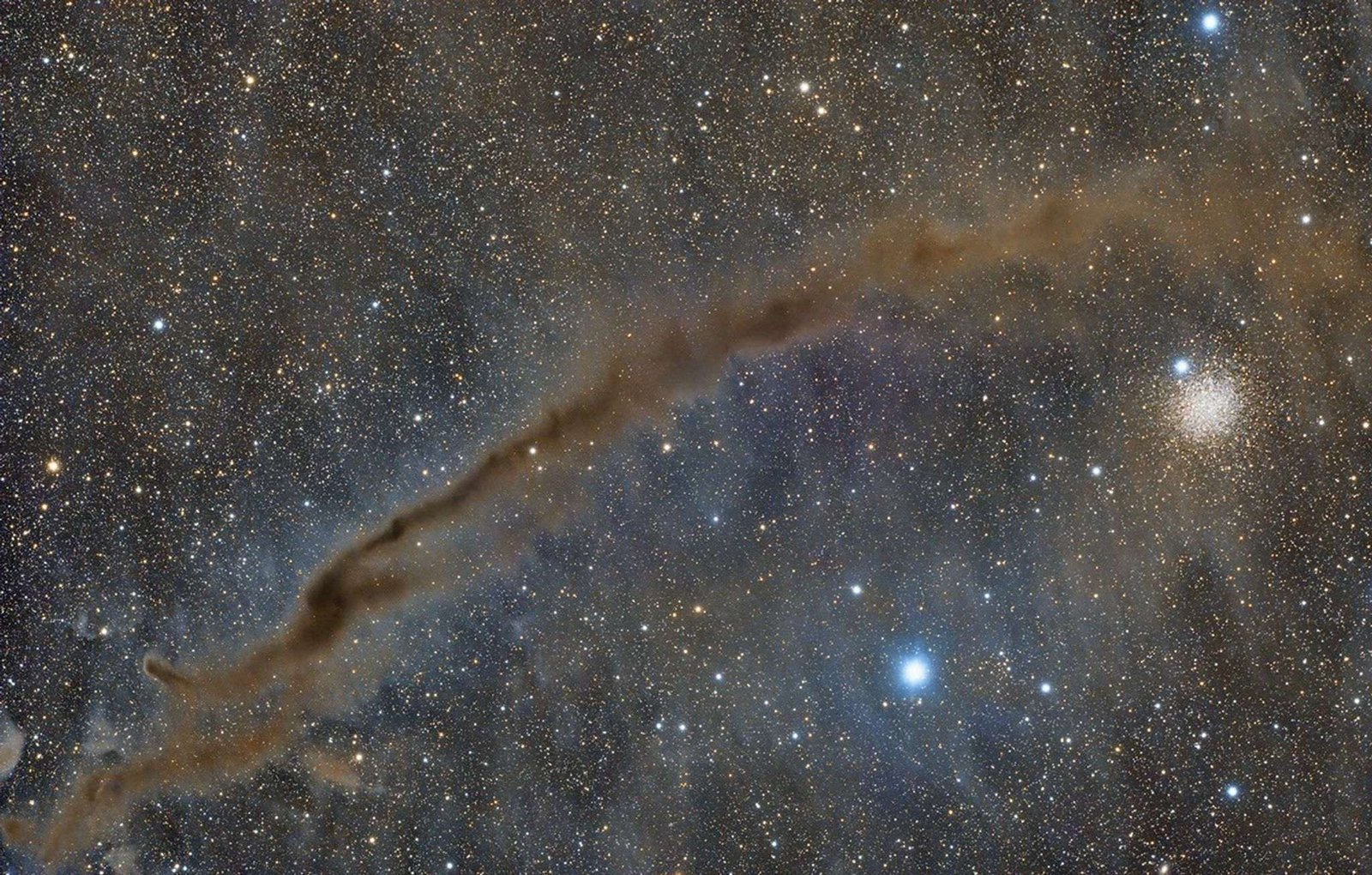 A telescopic image of a dark nebula.