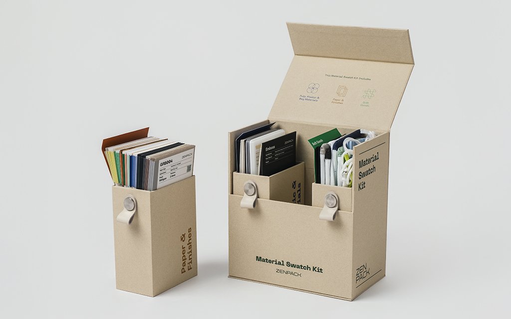 An open Swatch Kit binder displaying various textured sustainable paper and ocean plastic material samples.