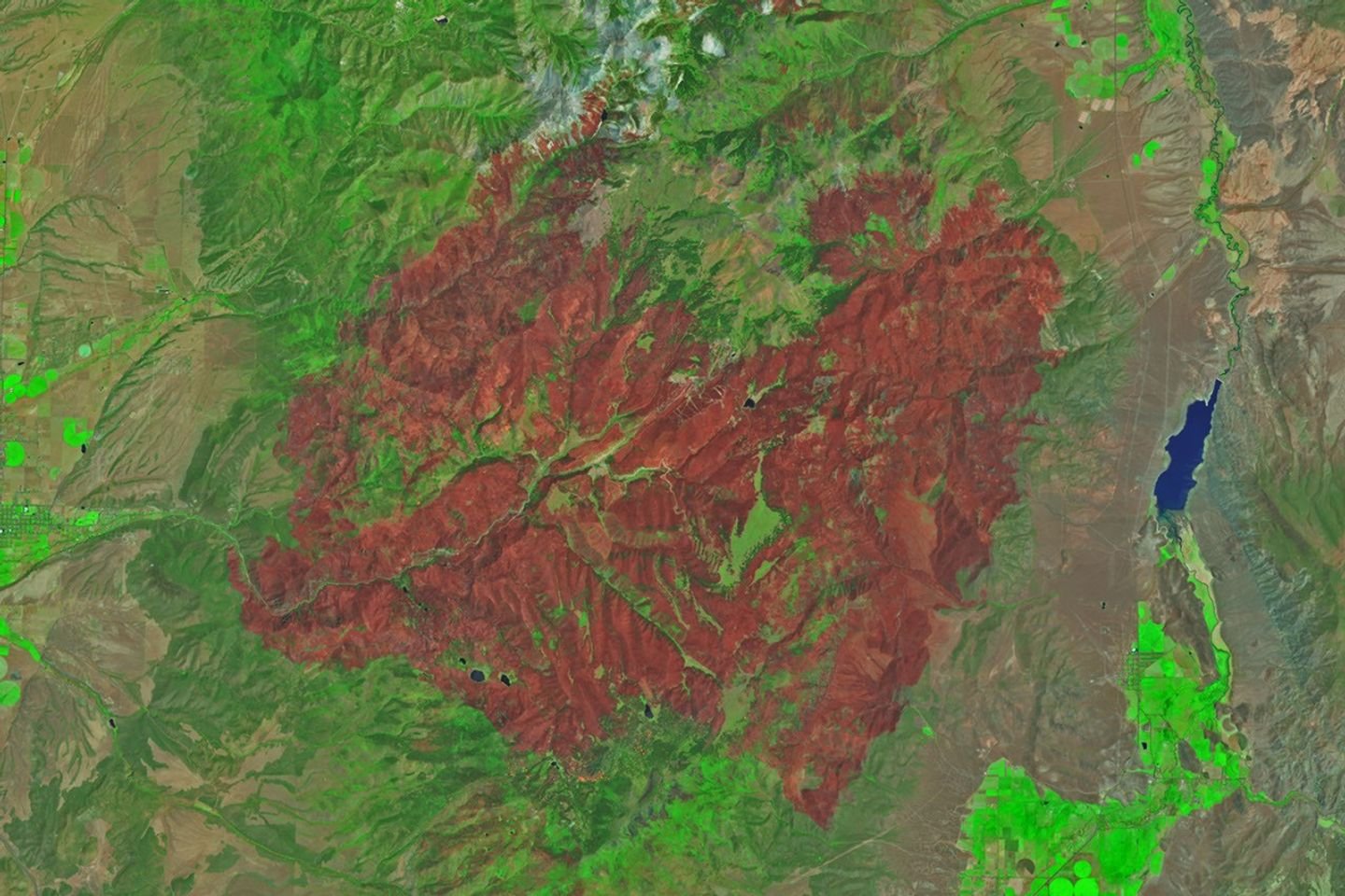 An image of the same area shows a large brown patch spanning much of the image in an image acquired after the fire on June 29, 2026.