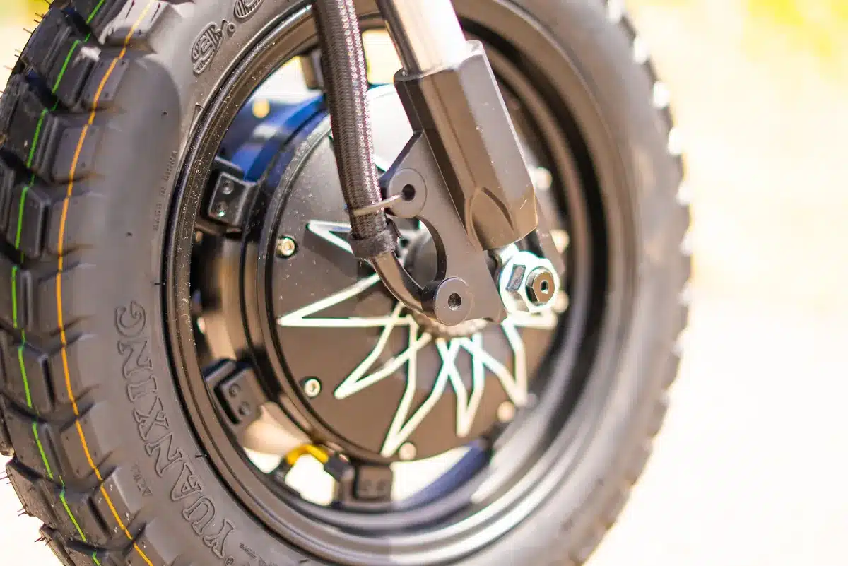 EMOVE RoadRunner Pro V2 Review: Surron Power in a Tiny, Stealthy Package 13 EMOVE RoadRunner Pro V2 front hub motor and 14 inch tubeless tire