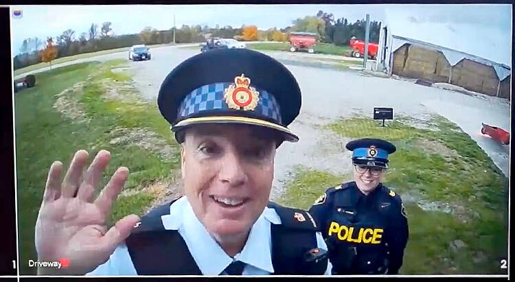 Auxiliary Inspector Brad Hull, OPP West Region regional commander, left, and Sgt. Jill Johnson of OPP West Region’s Crime Prevention and Community Support Bureau, right, demonstrate how clear high quality video surveillance can provide critical information regarding theft and mischief on a farm during on video on curtailing rural crime as part of the Grey Bruce Farmers Week On-Demand sessions. Screengrab Image.