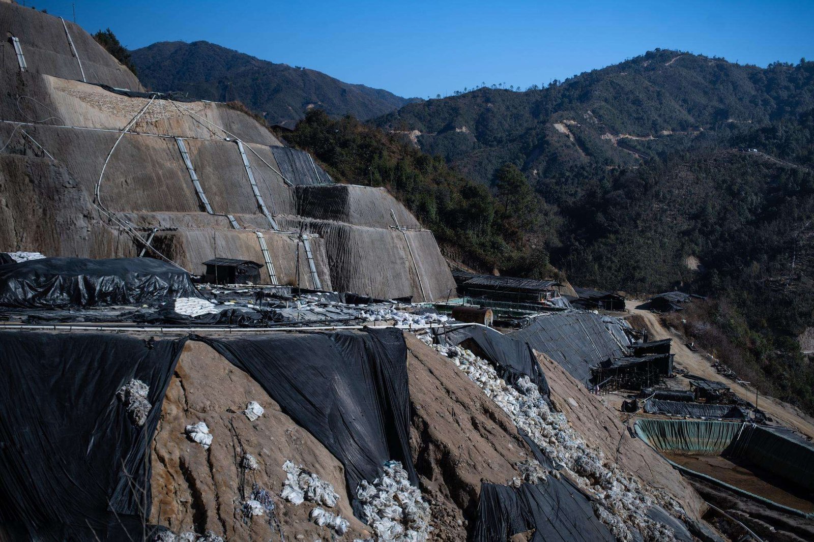 a mining operation carved into a mountain range