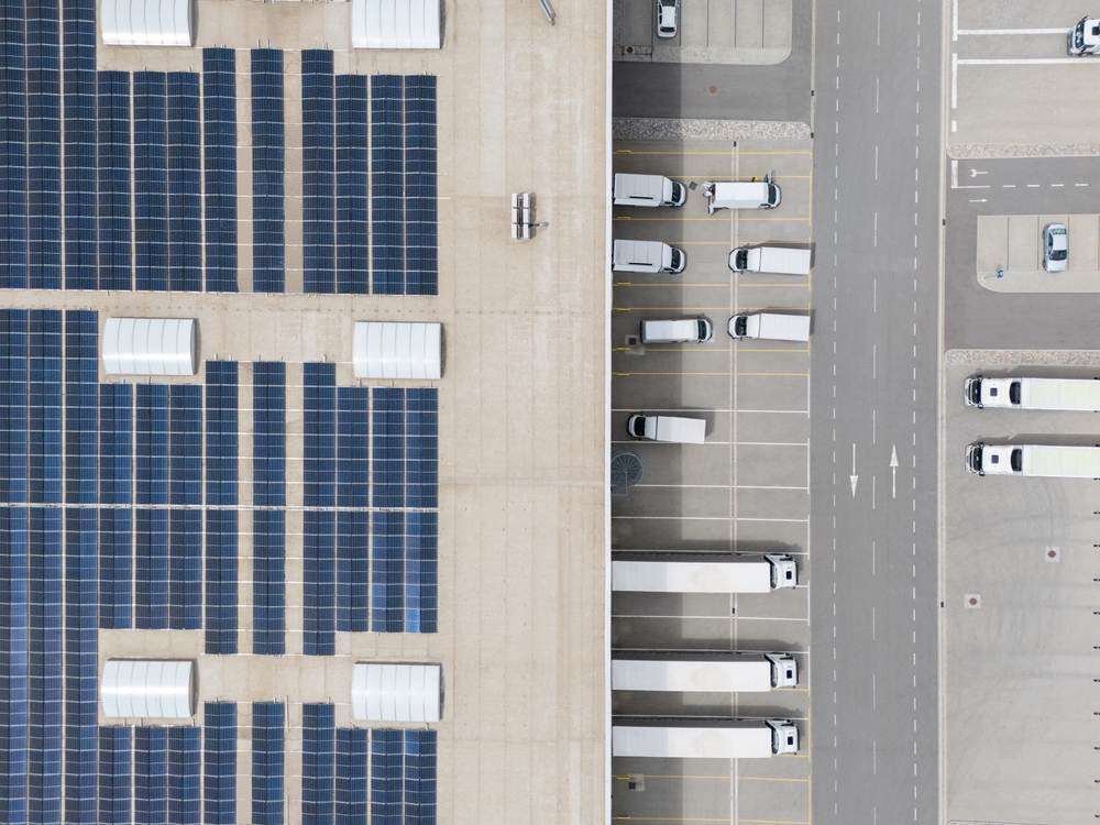 A logistics center with solar panels viewed from above.