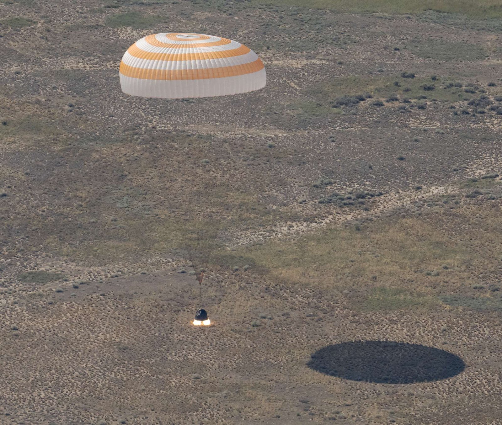 The Soyuz MS-28 spacecraft is seen as it lands in a remote area near the town of Zhezkazgan, Kazakhstan