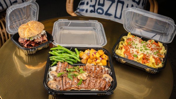hinged food containers on table at restaurant