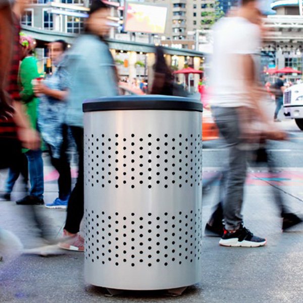 A large trash bin in a city center that will collect large amounts of waste