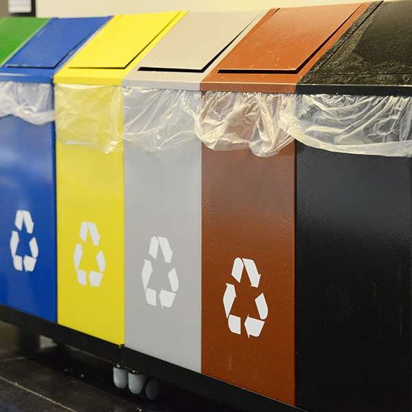 A set of badly designed trash and recycling bins that will cause incorrect sorting