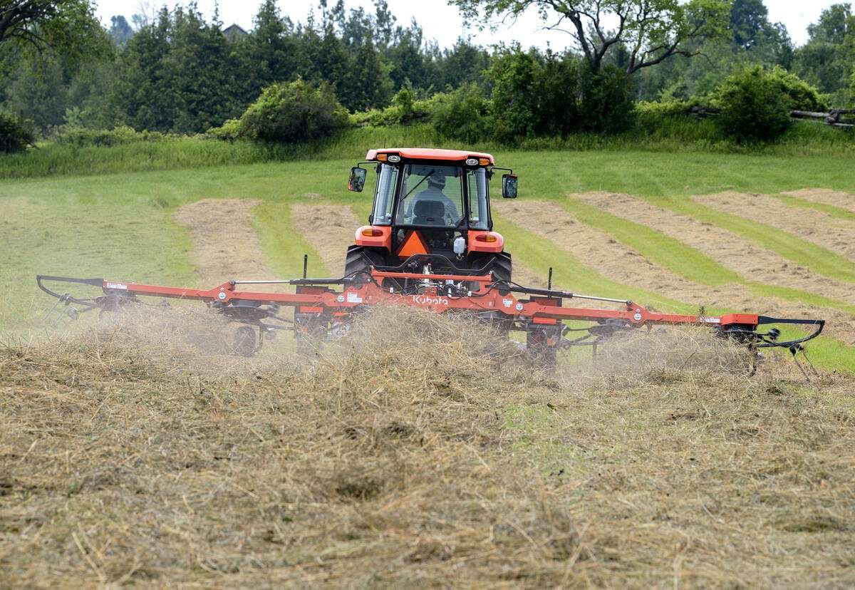 Kubota’s TE6576C’s six-rotor trailed tedder throws hay during the Forage Expo near Norwood, Ont., July 9. Photo: Diana Martin