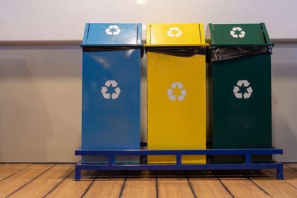 A poorly designed trash and recycling system that will cause confusion and contamination