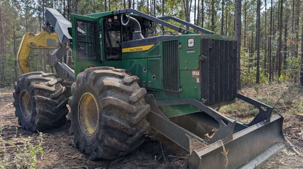 A John Deere 648L-II Skidder with 35.5L-32 Titan ForestEdge tires