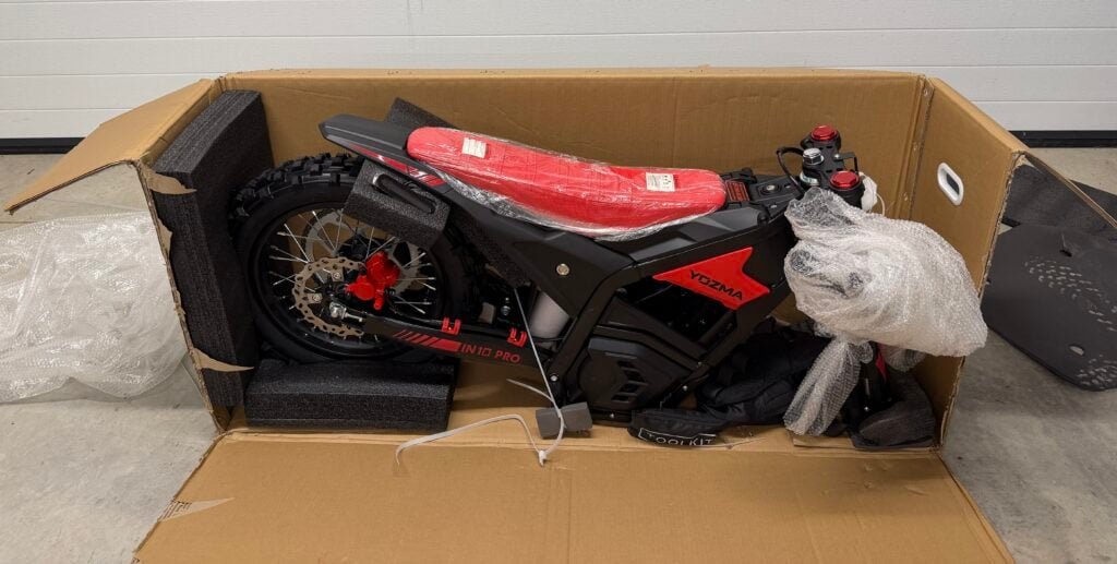 Yozma IN10 Pro Review: Is This $2,000 E-Dirt Bike a Real Sur Ron Killer? 2 Yozma IN10 Pro partially assembled during unboxing