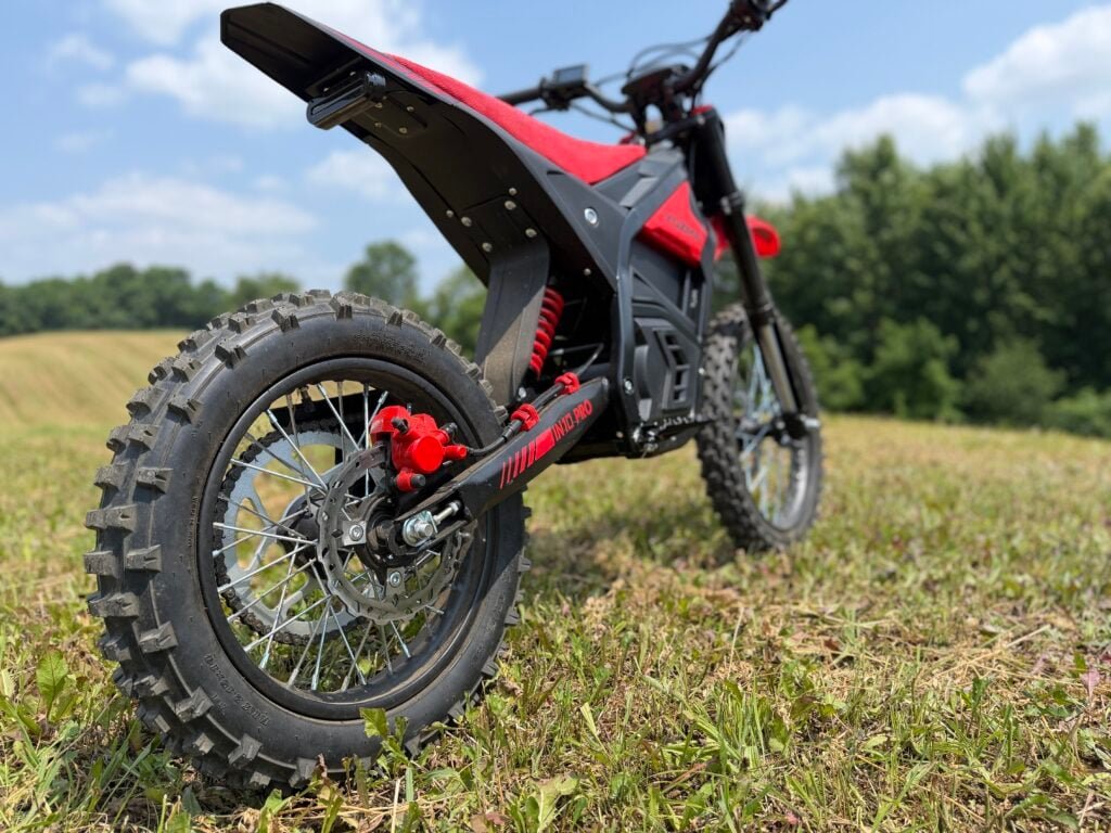 Yozma IN10 Pro Review: Is This $2,000 E-Dirt Bike a Real Sur Ron Killer? 3 Yozma IN10 Pro rear three-quarter view showing the 14-inch rear wheel