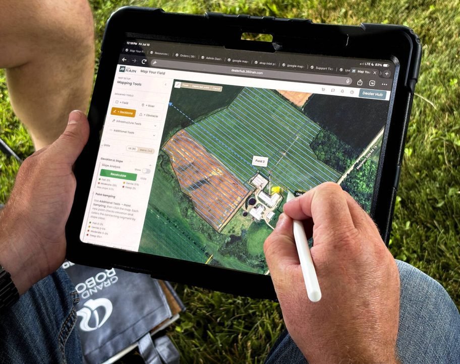 Loren Weaver, 360 Yield Center regional manager, out of Morton, Illinois, demonstrates how simple it is to develop a field plan for the Rain 360 autonomous irrigation system by pulling up a farmer's field and running a test layout during Grand River Robotic's demonstration day at Carl Brubacher's farm, near Arthur, Ont., on July 10, 2026. Photo: Diana Martin