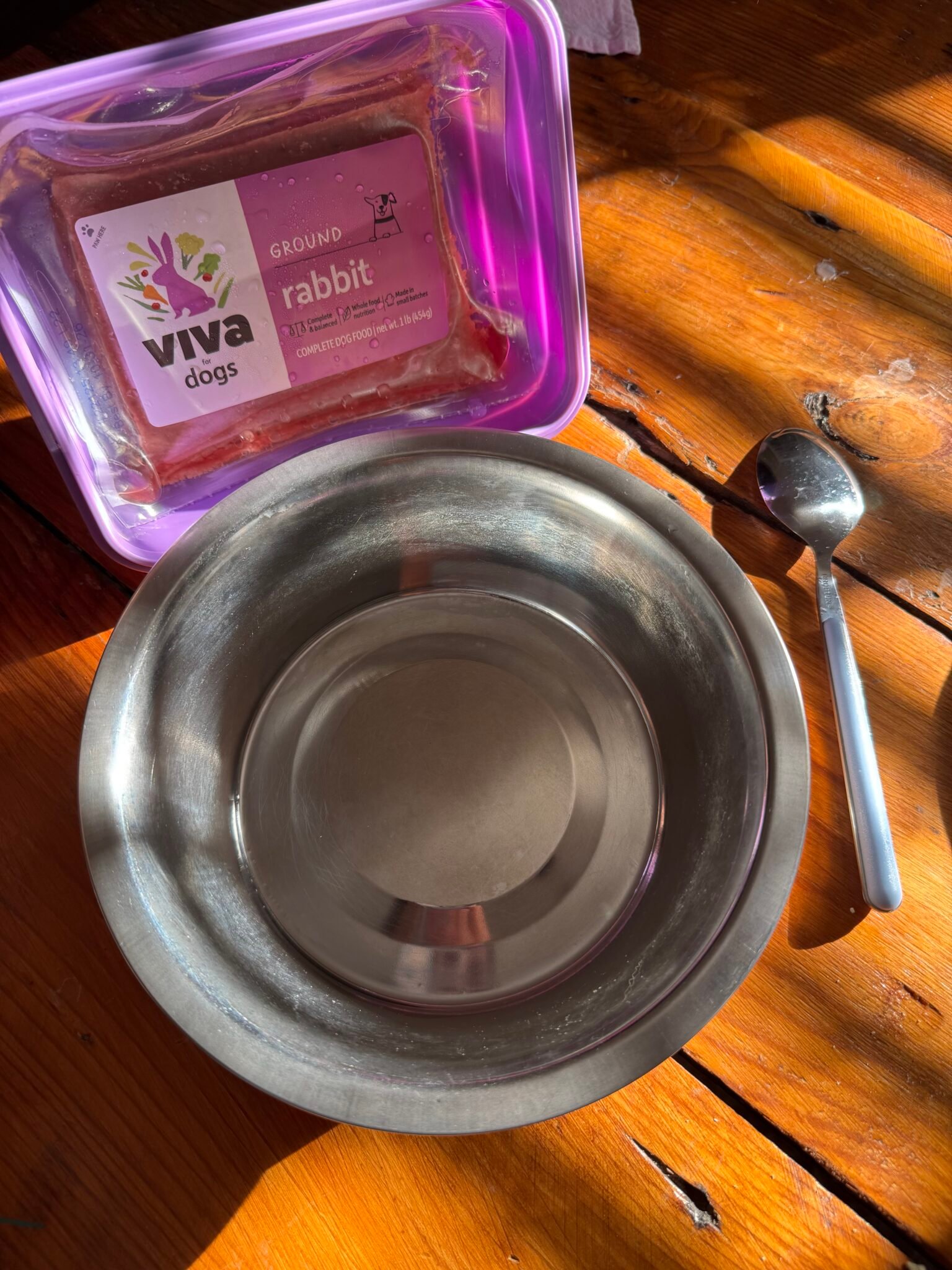 A bowl and spoon on a table.