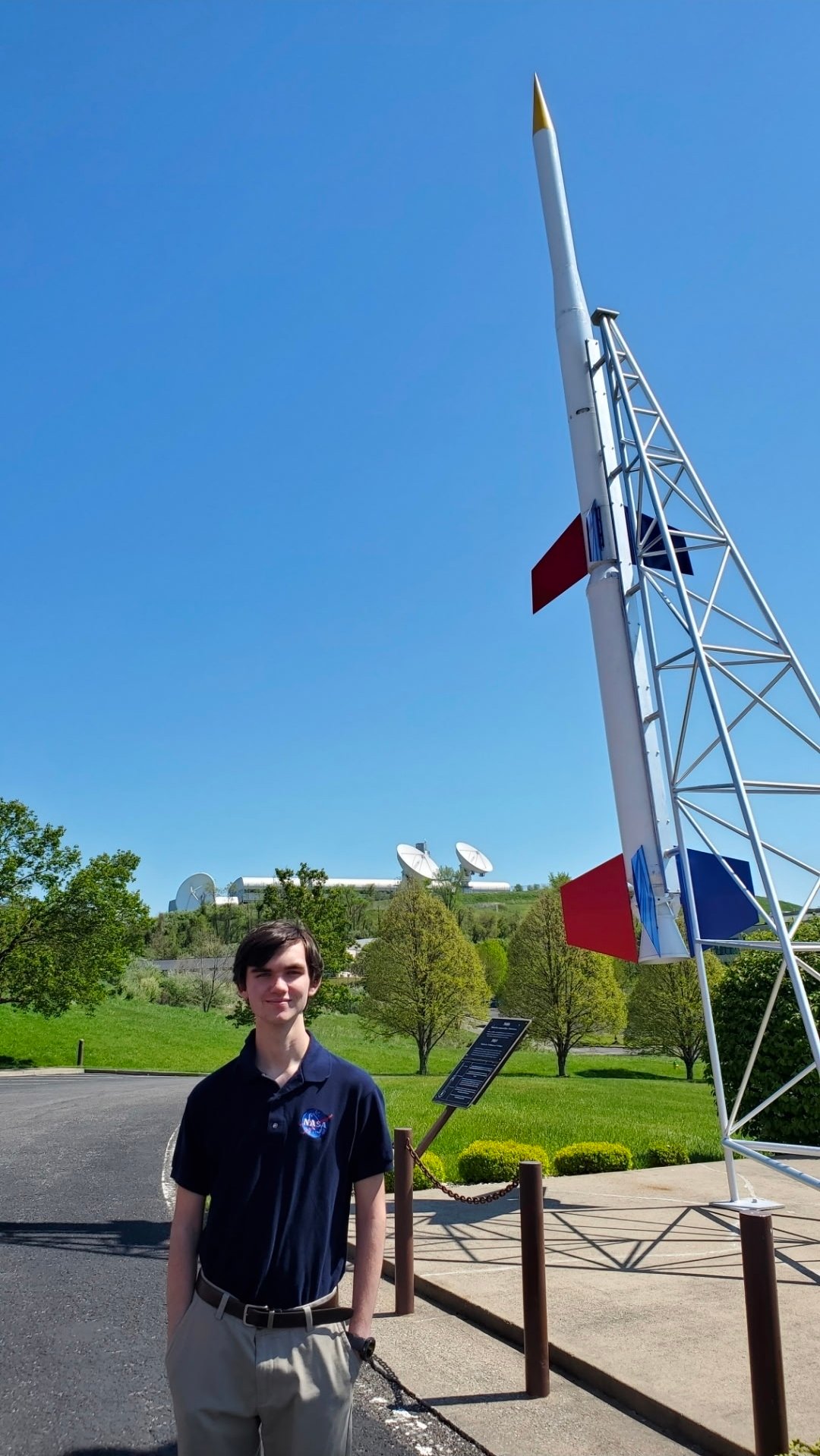 Fletcher Newell stands in front of a sounding rocket.