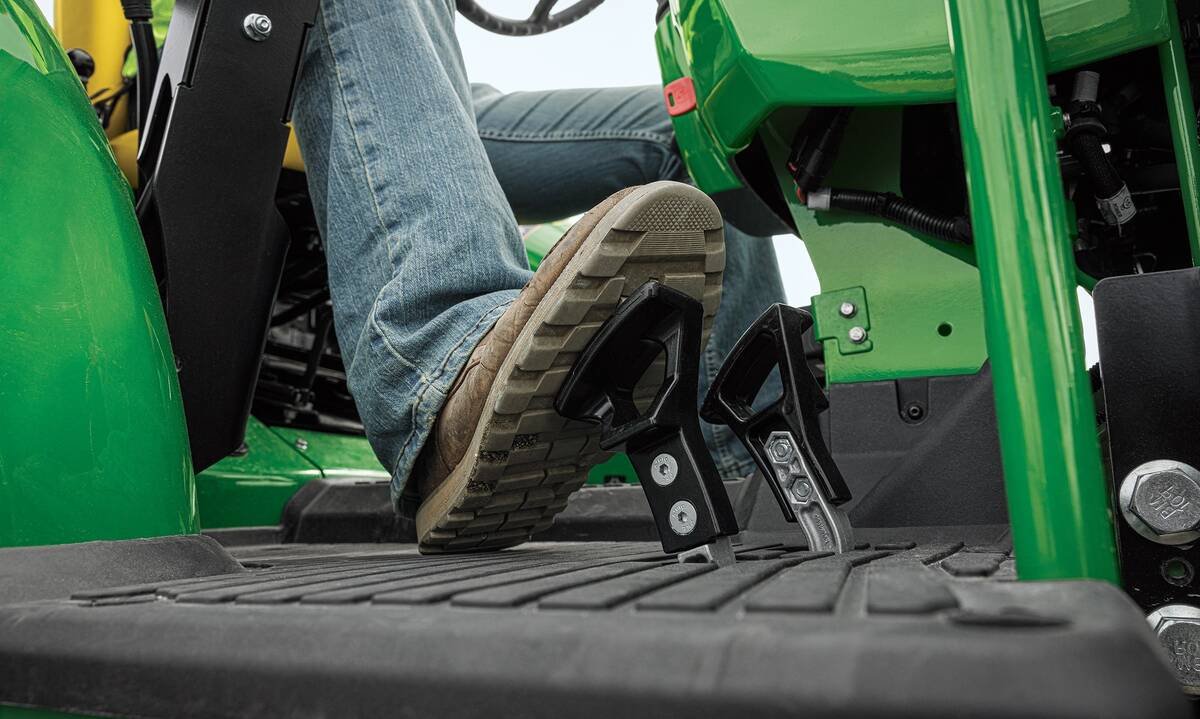 John Deere’s new 5E 3-cylinder utility tractors feature TwinTouch foot pedals to control its optional eHydro transmission.