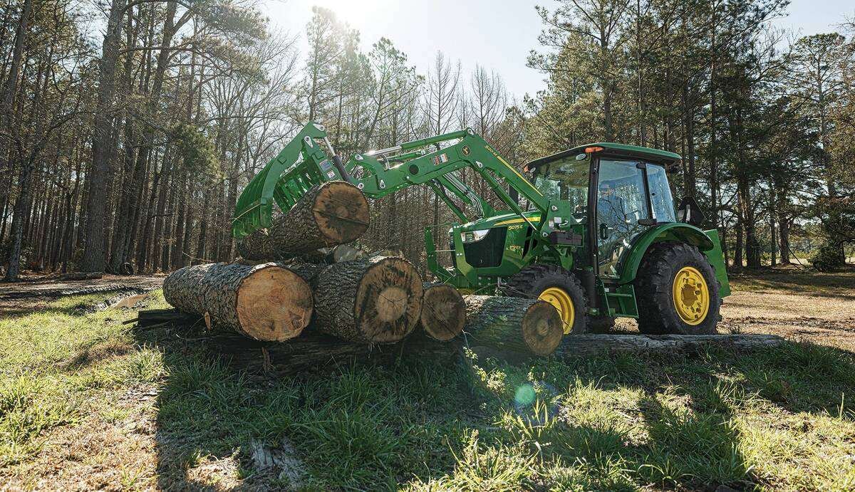 A John Deere 5E series tractor in loader mode.