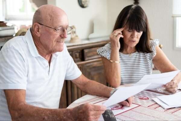 Ontario electricity support couple image a couple sitting at a table looking at official papers