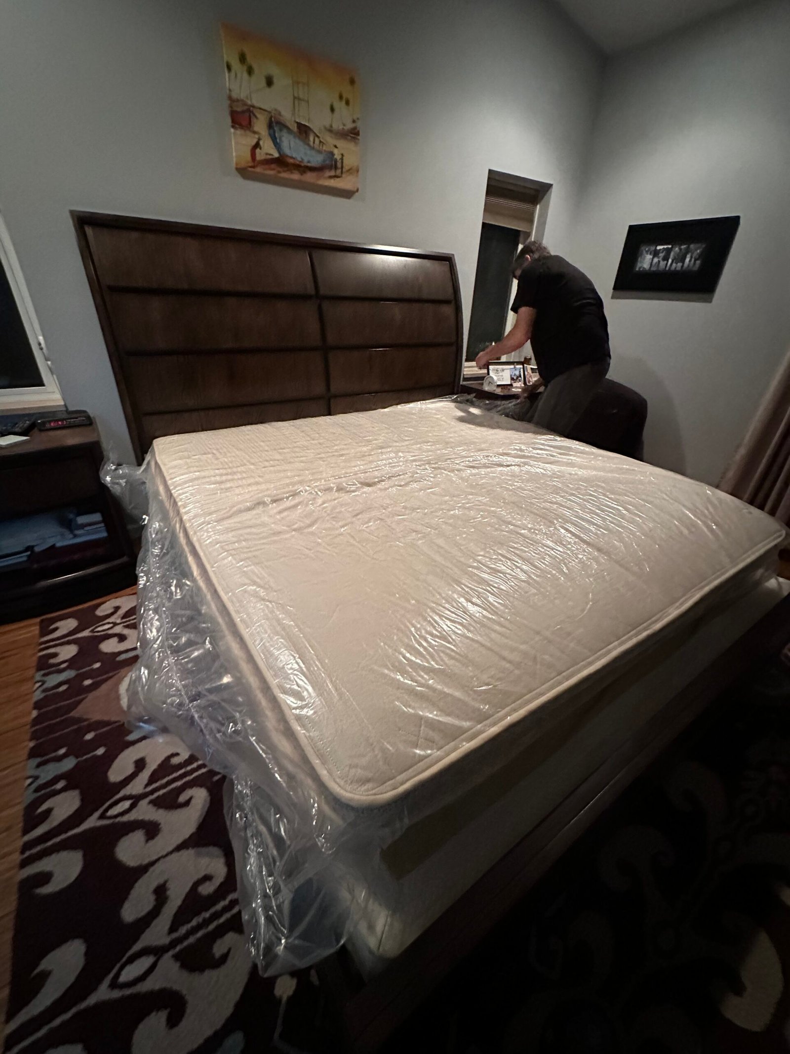 Setting up the Birch Luxe mattress on a bed frame. 