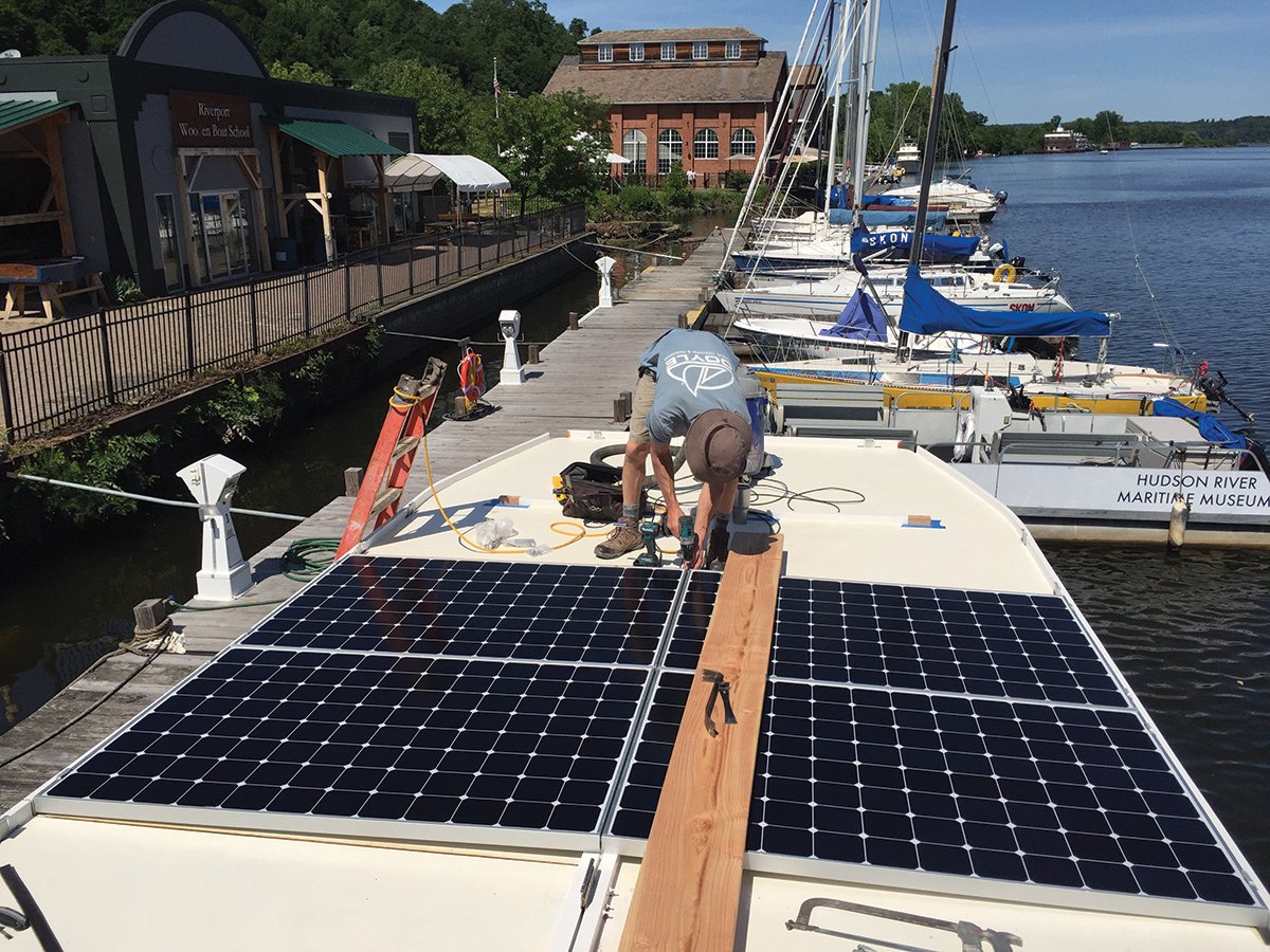 Attaching panels to Solaris roof.