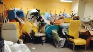Discarded healthcare furniture illustrating premature upholstery failure and material waste
