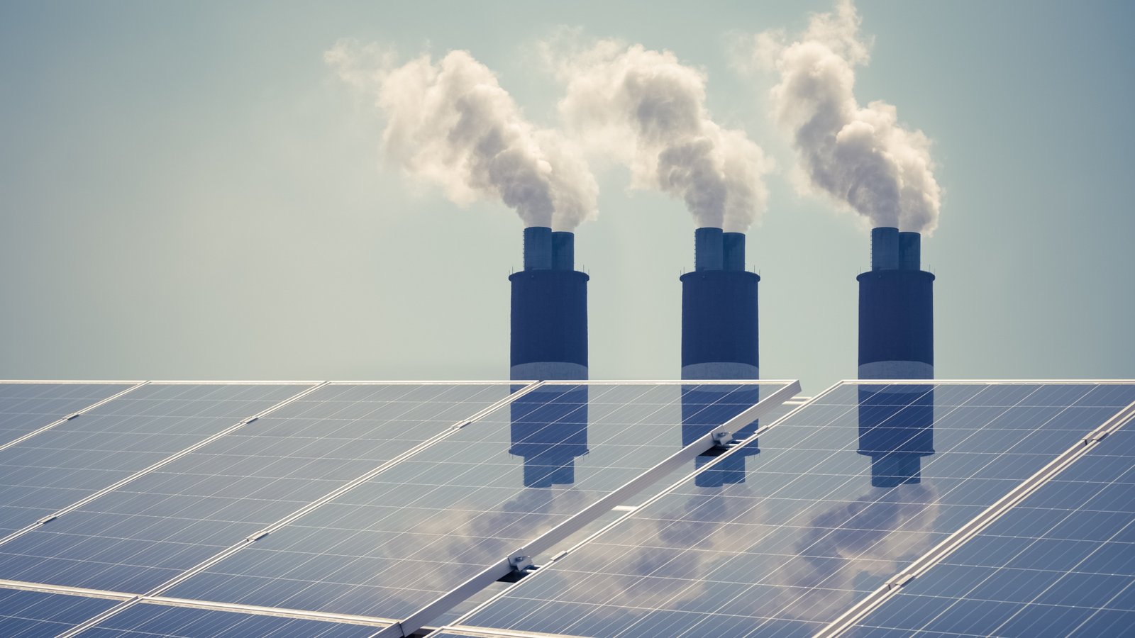 clean energy with pollution, roof solar panels reflected thermal power station exhaust steam