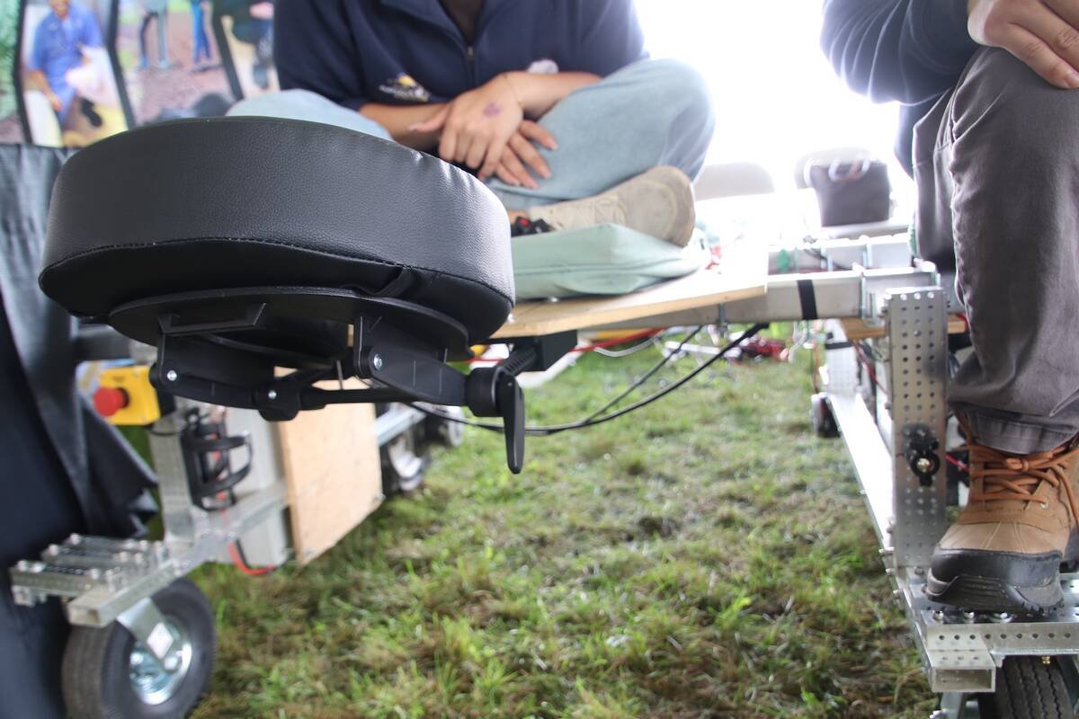 Close-up of the Taro Cobot's black padded face cradle mounted at the end of the bed, with the frame and a wheel below it. Photo: Jonah Grignon