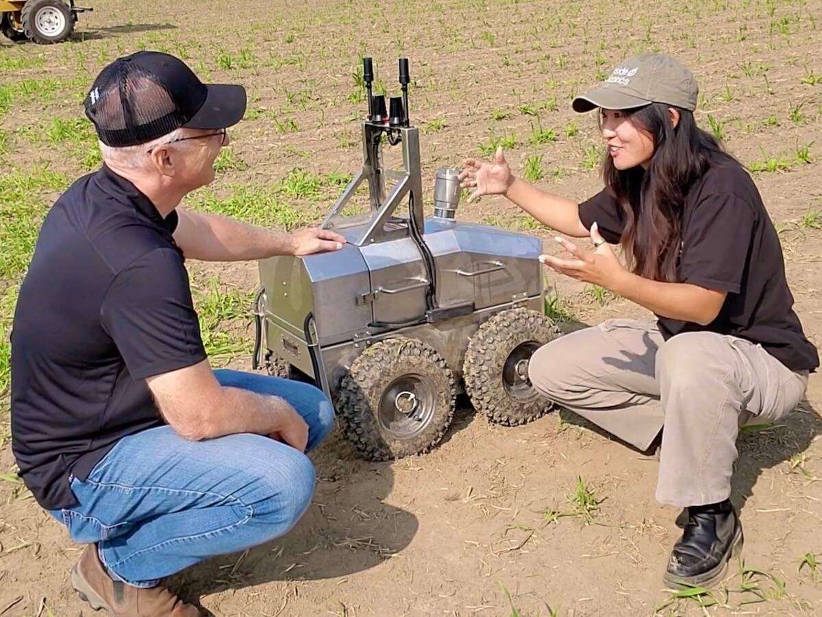 Upside Robotics’ Jana Tian introduced Glacier FarmMedia’s Scott Garvey to the company’s robot ‘Beethoven’ at Canada’s Outdoor Farm Show in 2024. Photo: Farmtario video screengrab