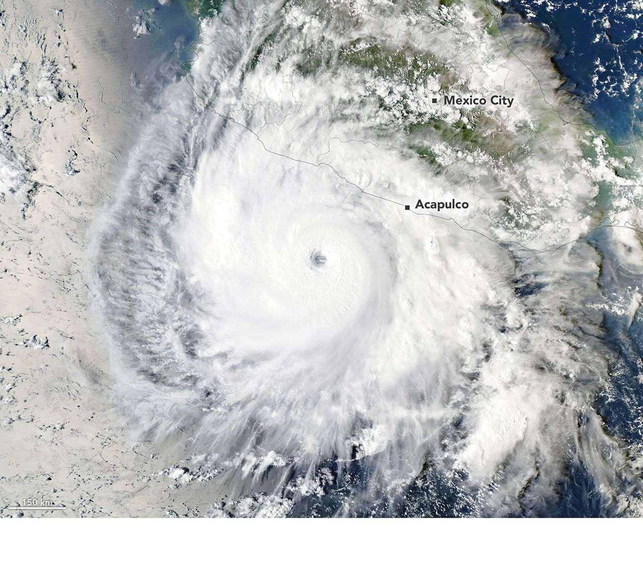 Hurricane Polo, with a well-defined eye, swirls over the Pacific Ocean off the coast of Mexico. The storm was positioned just south of Acapulco, with its outer cloud bands extending inland toward Mexico City.
