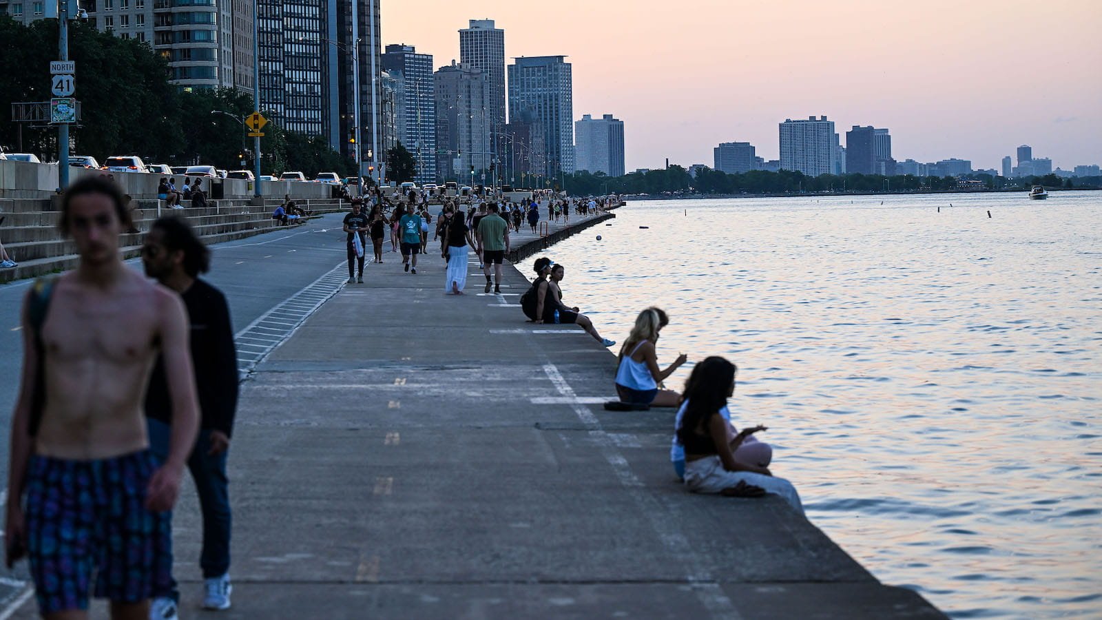 People seen at the edge of Lake Michigan in Chicago