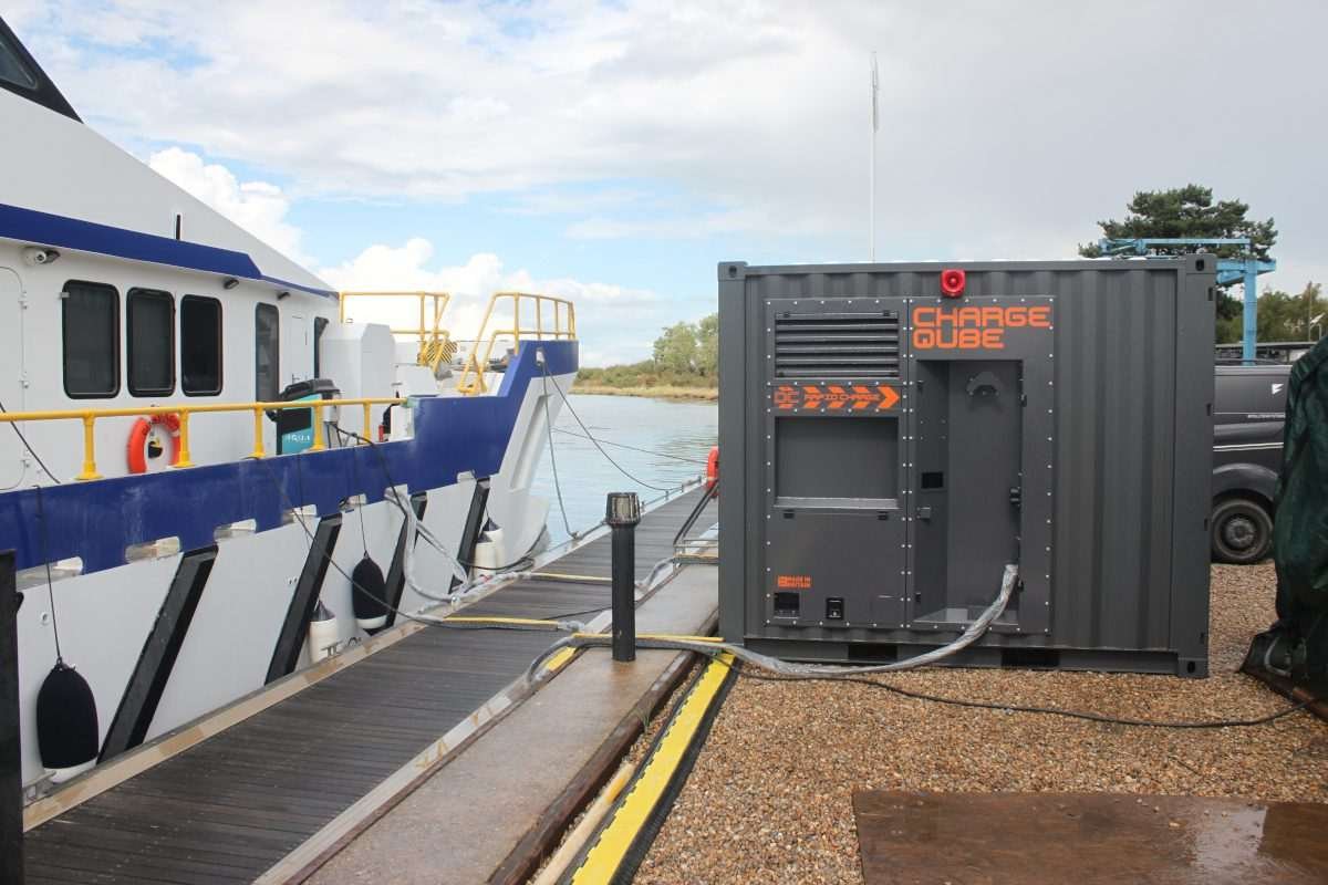 Fellten Charge Qube mobile battery system beside Tidal Transit’s e-Ginny electric crew-transfer vessel at the quayside