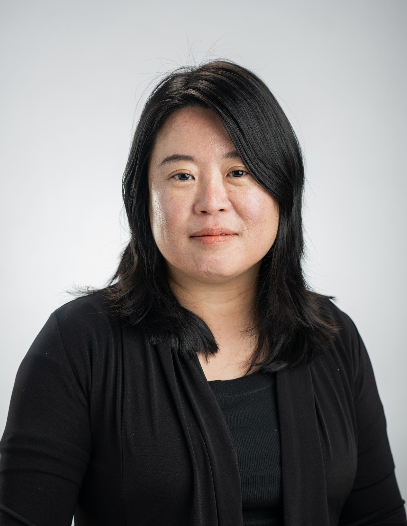 Portrait of Keiko Nomura in a black shirt.