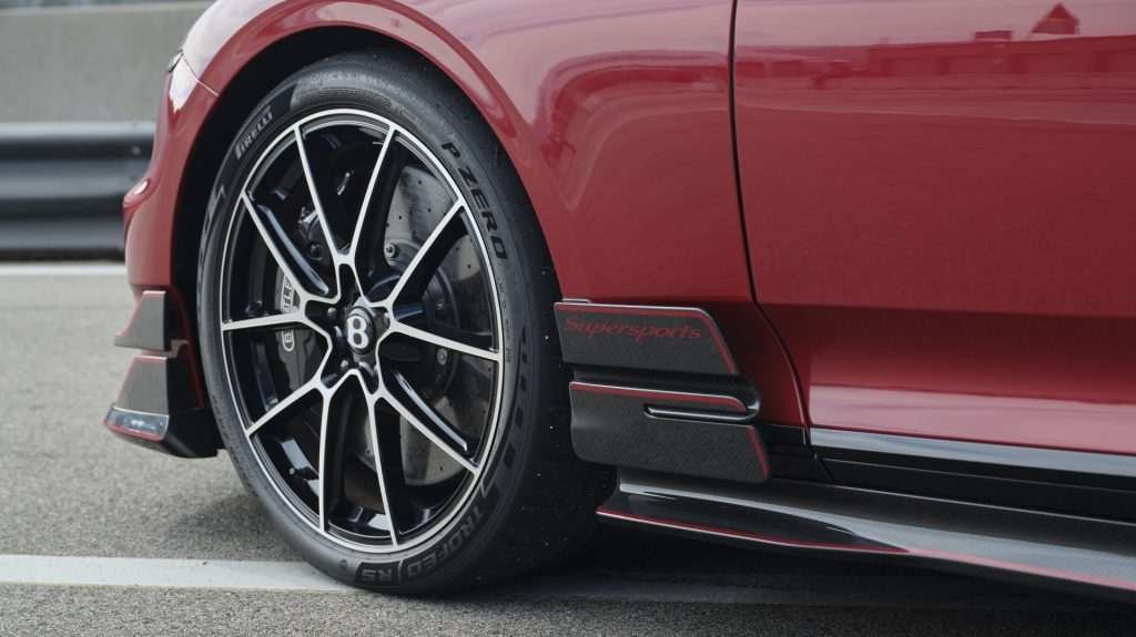 Close up of the Pirelli P Zero tire on a red Bentley Supersports