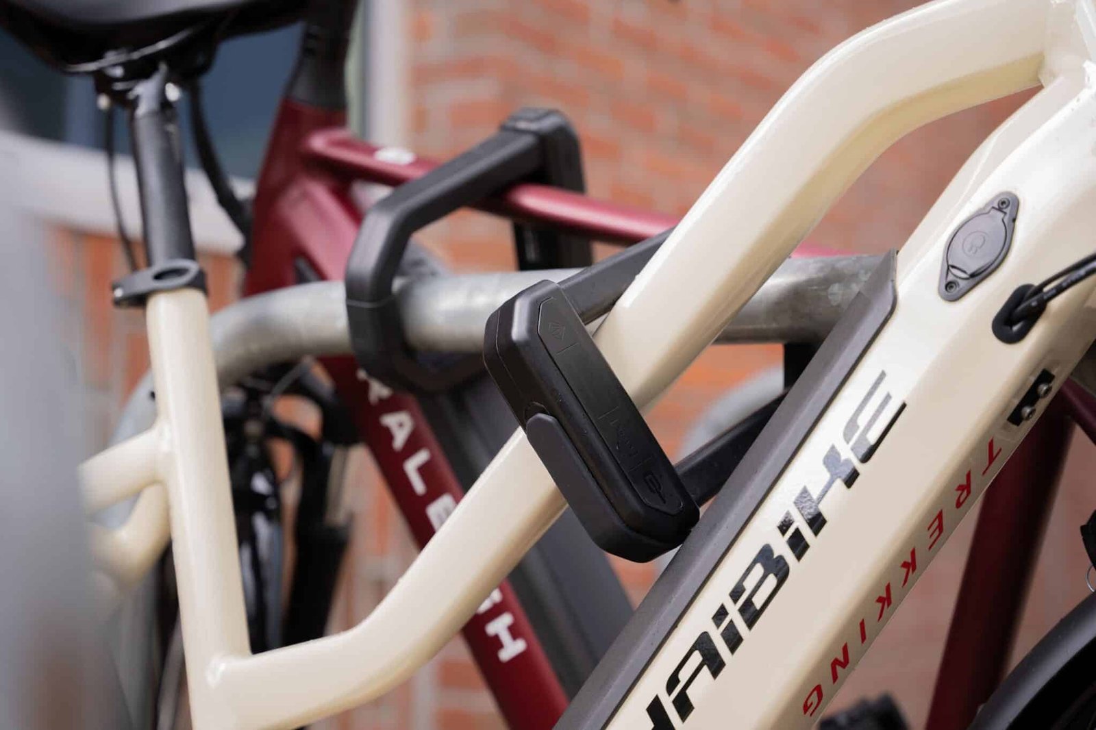 The 5 Best eBike Locks on Amazon (Thieves Hate These) 12 Rider locking an electric bike to a rack with a Hiplok D1000 U-lock