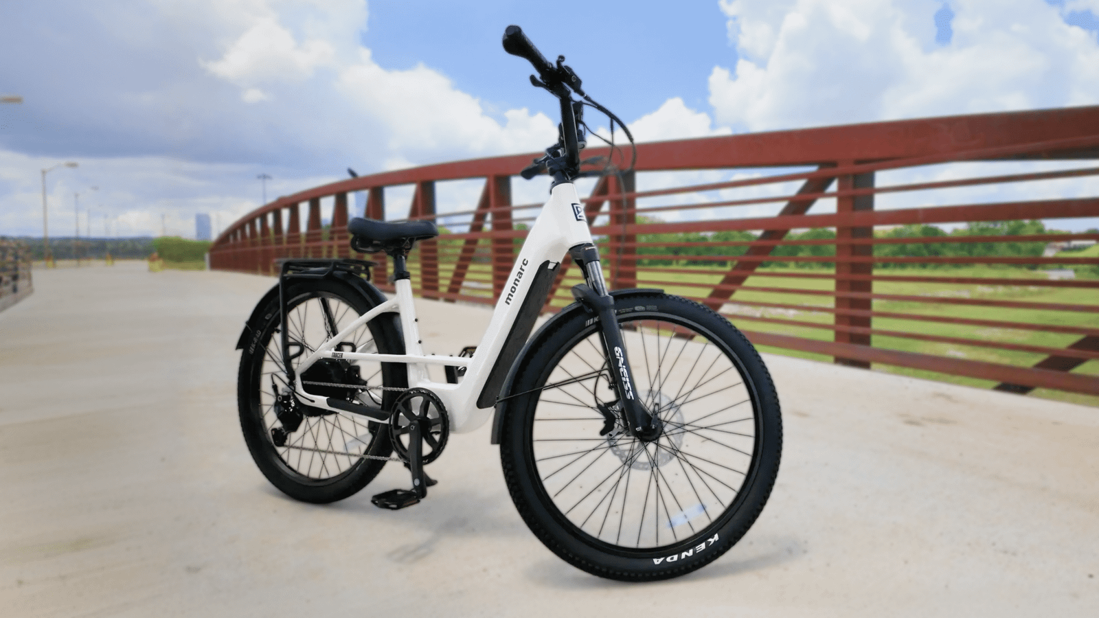 Monarc Tracer long-range city ebike parked on a bridge path