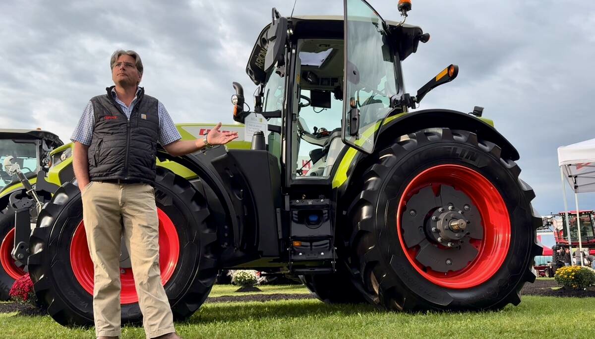 Frans Reijmers presents a Claas Arion 6 tractor at Canada's Outdoor Farm Show.