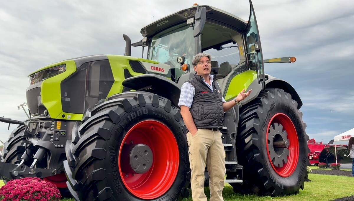 Frans Reijmers presents a Claas Axion 9 tractor at Canada's Outdoor Farm Show.