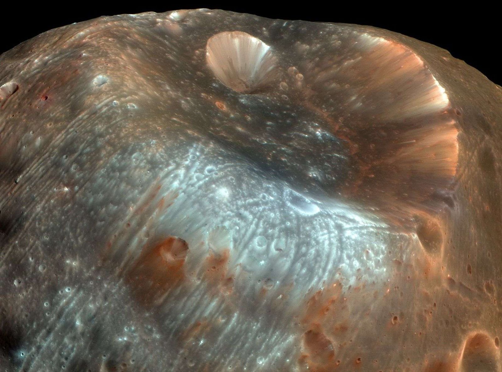 A color enhanced close-up image of Stickney Crater on Phobos.