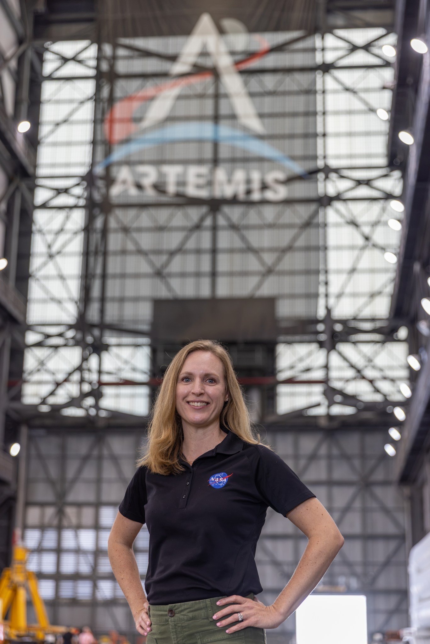 Allison Mjoen poses for a photo inside the Vehicle Assembly Building.