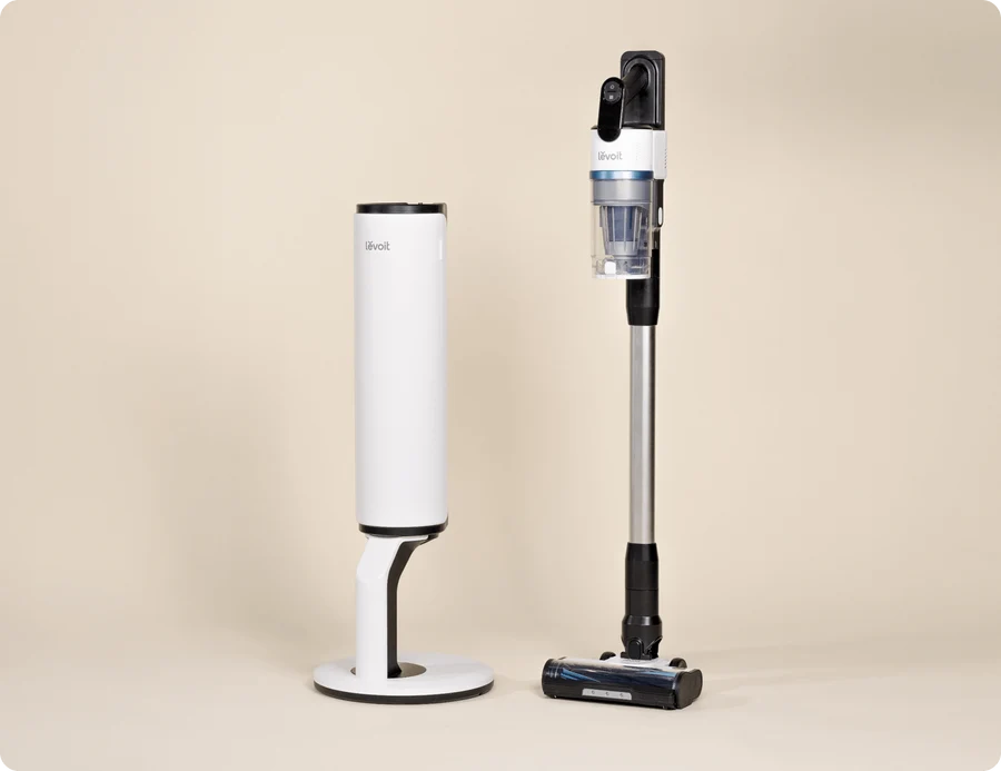 Levoit cordless stick vacuum cleaner with its upright charging and storage station.