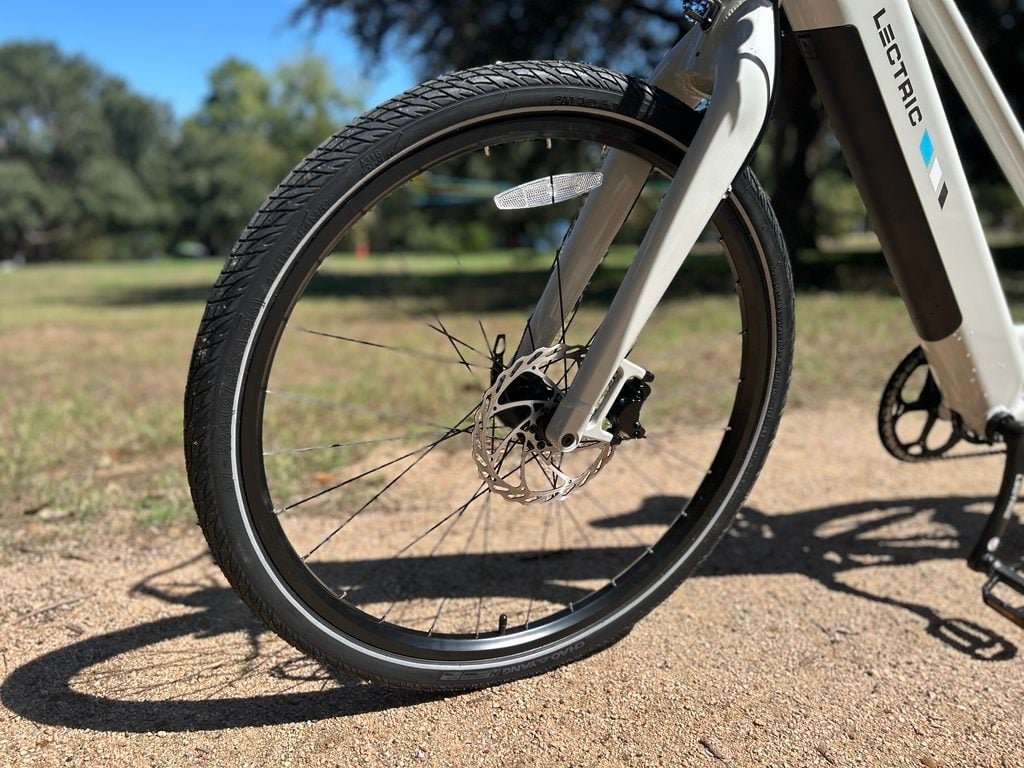 Lectric XPress Lite front wheel with the rigid aluminum fork, thru-axle and 180mm hydraulic disc rotor