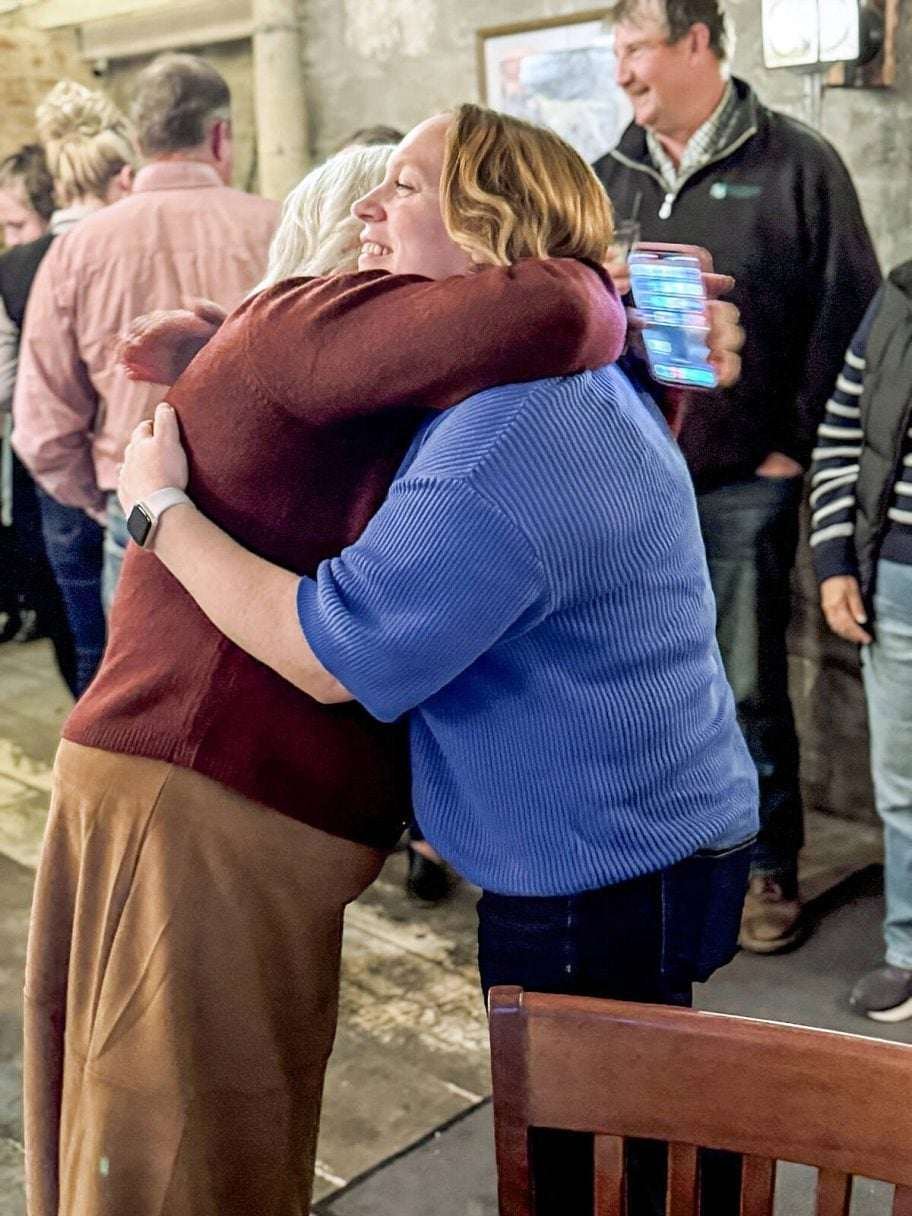 Sheryl McCallum, left, hugs her daughter,  Jenn Kyle, right, after learning Kyle had been elected Brant County mayor. Photo: Courtesy of Jenn Kyle
