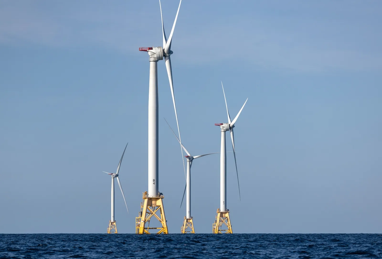 A group of wind turbines generate electricity at the Block Island Wind Farm off the coast of Rhode island. The clean energy industry has pushed for provisions that would prevent President Trump from cancelling future offshore wind permits.