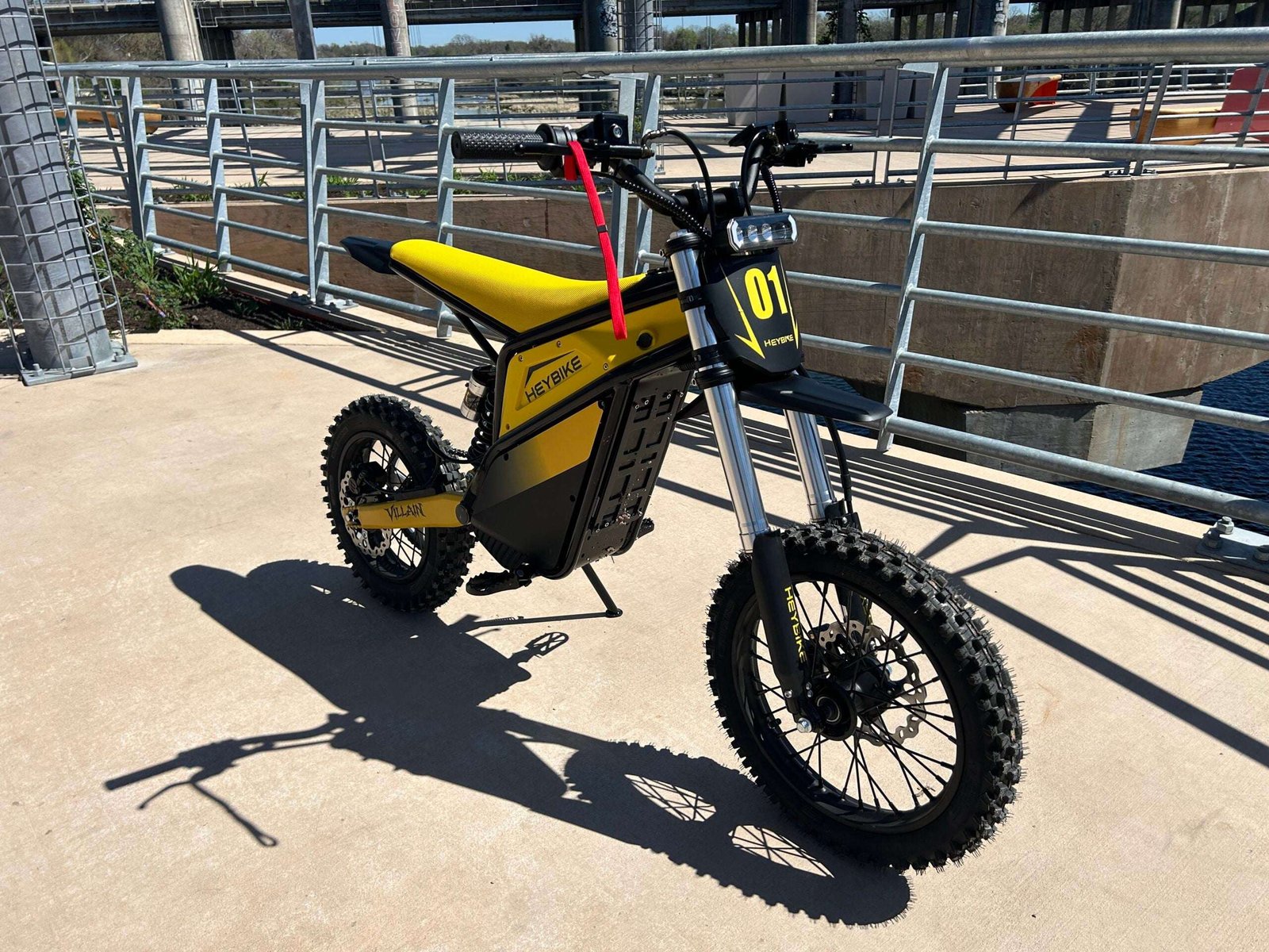 Heybike Villain electric dirt bike on the RiderGuide test day, front three quarter view with the 01 number plate